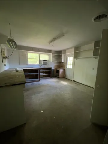 a kitchen with a refrigerator and a sink