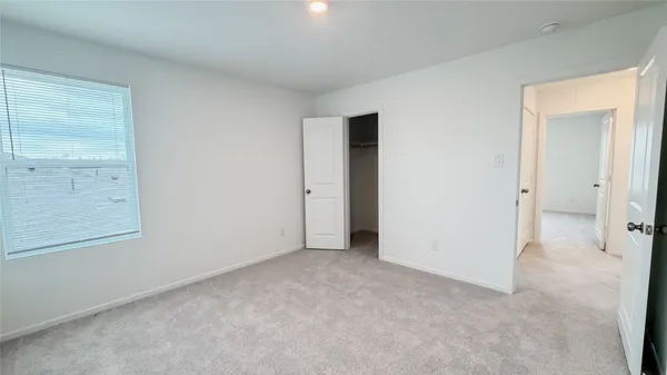 an empty room with closet area