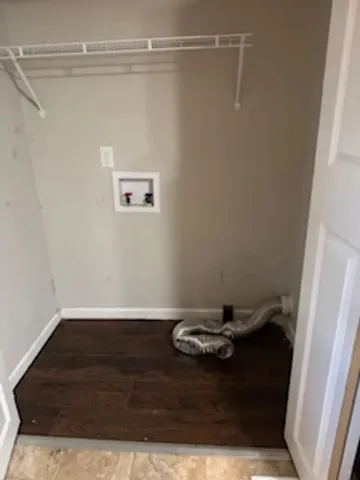 a view of room with wooden floor