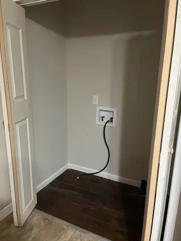 a room with a shower and a glass door