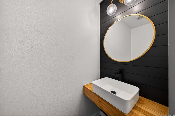 a bathroom with a toilet and a mirror
