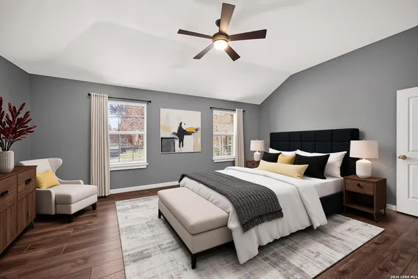 a bedroom with a bed couch and a window