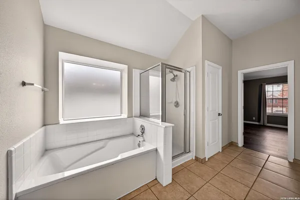 a bathroom with a bathtub and a shower