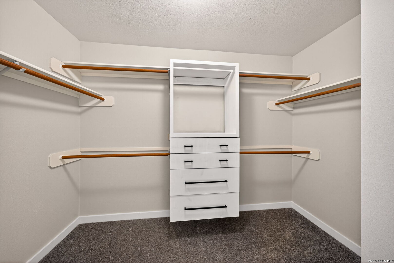 1016 Mourning Dove Schertz, TX 78154 - Photo 26 of 40 a view of walk in closet with empty racks