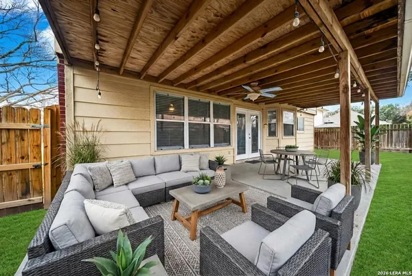 a view of living room with patio furniture and garden view