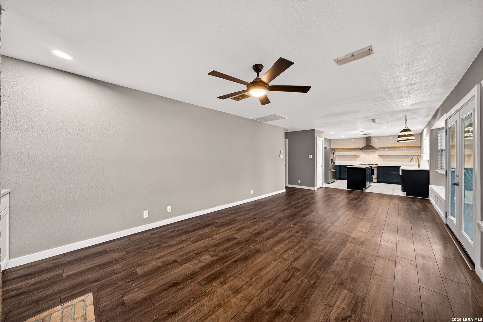 1016 Mourning Dove Schertz, TX 78154 - Photo 10 of 40 wooden floor in an empty room with a fireplace