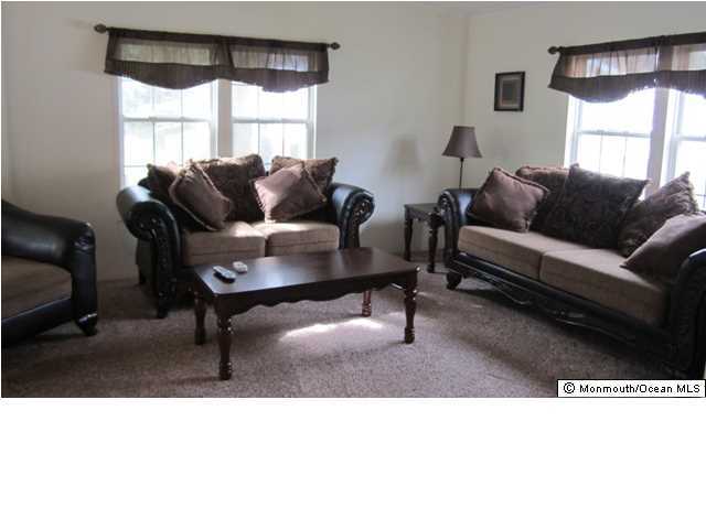 88 Village Road Morganville, NJ 07751 - Photo 8 of 10 a living room with furniture and a window