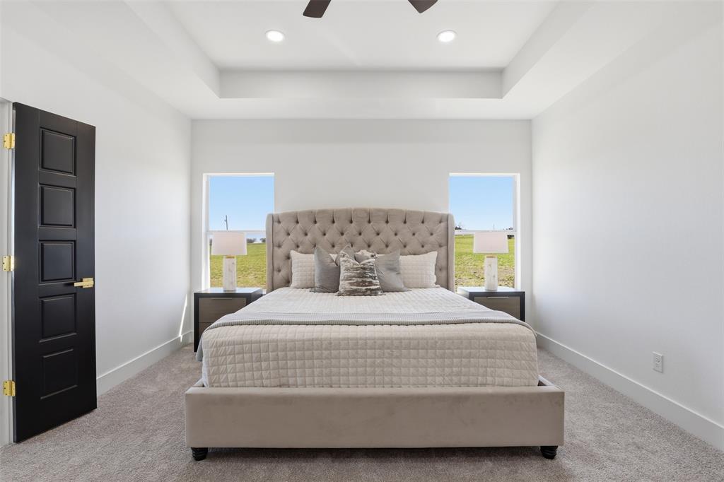 6657 Buffalo Ridge Circle Godley, TX 76044 - Photo 16 of 31 a bedroom with a bed and a window