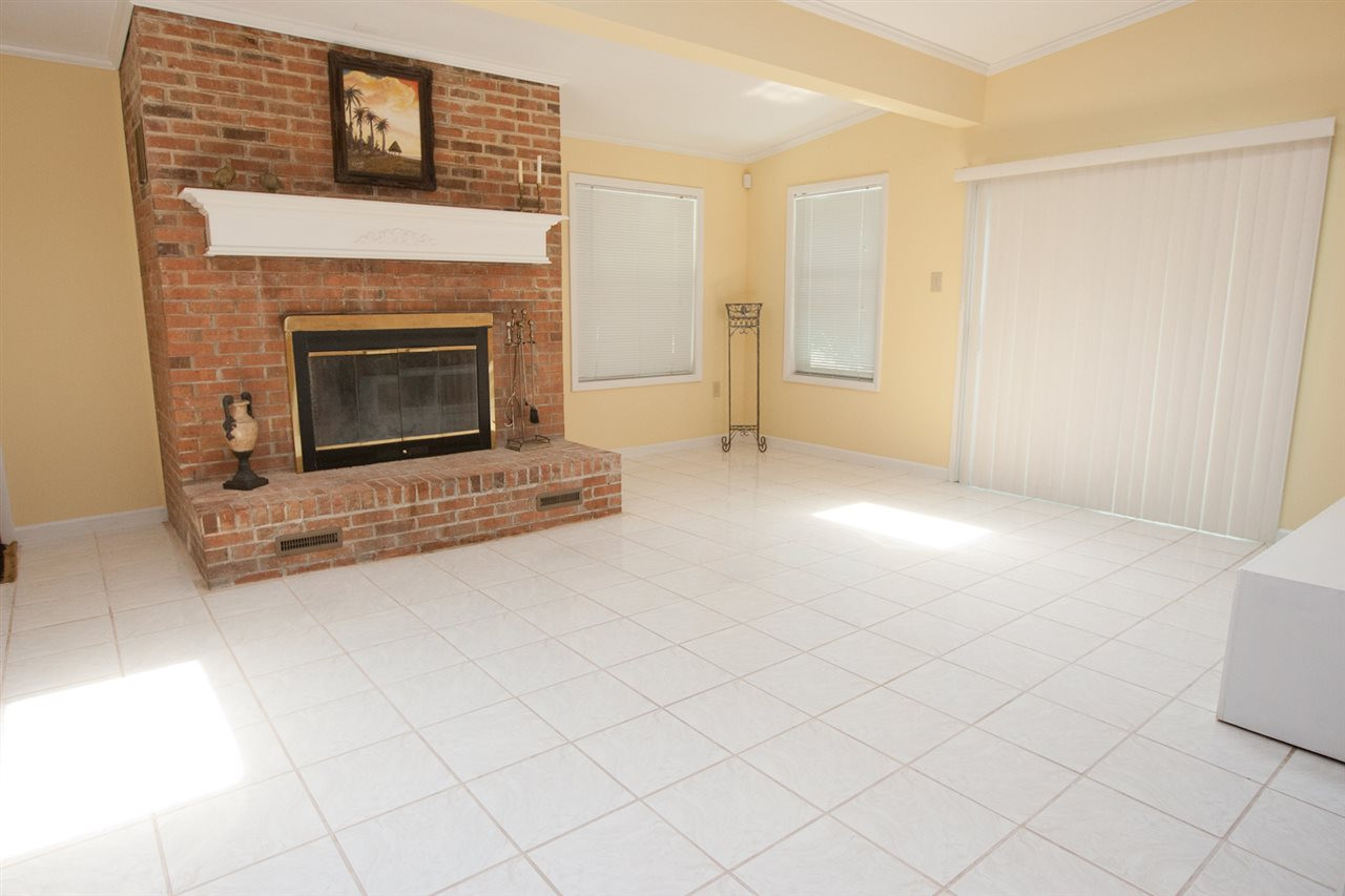 1201 Snow Hill Road Durham, NC 27712 - Photo 6 of 16 Tile sunroom with wood burning fireplace and two skylights offer plenty of light. Sunroom