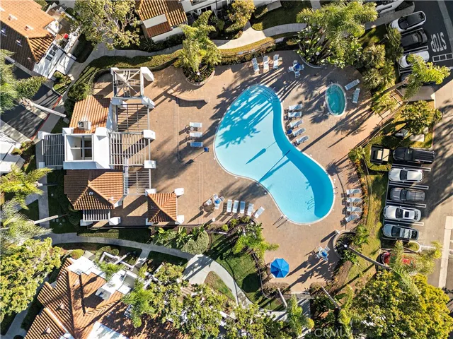 an aerial view of a house with a swimming pool