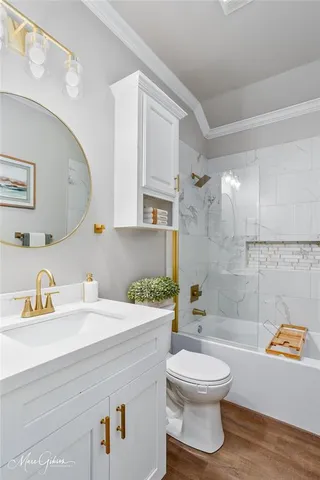 a bathroom with a sink a toilet and a shower