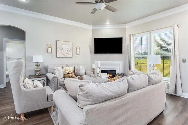 a living room with furniture fireplace and a flat screen tv
