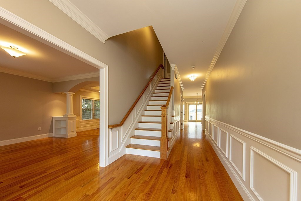 33 Liberty Avenue Lexington, MA 02420 - Photo 10 of 30 a view of entryway and hall with wooden floor