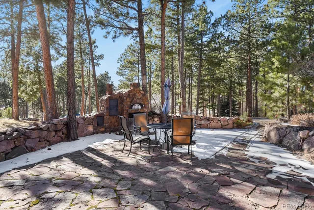 a view of a backyard with sitting area