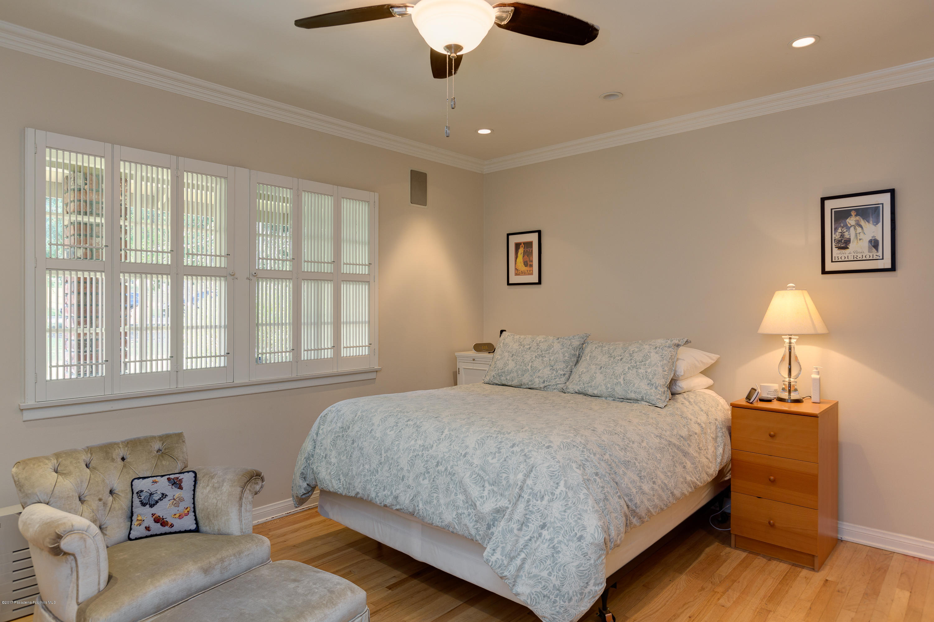 3740 Greenhill Road Pasadena, CA 91107 - Photo 12 of 23 a bedroom with a large bed and a chandelier