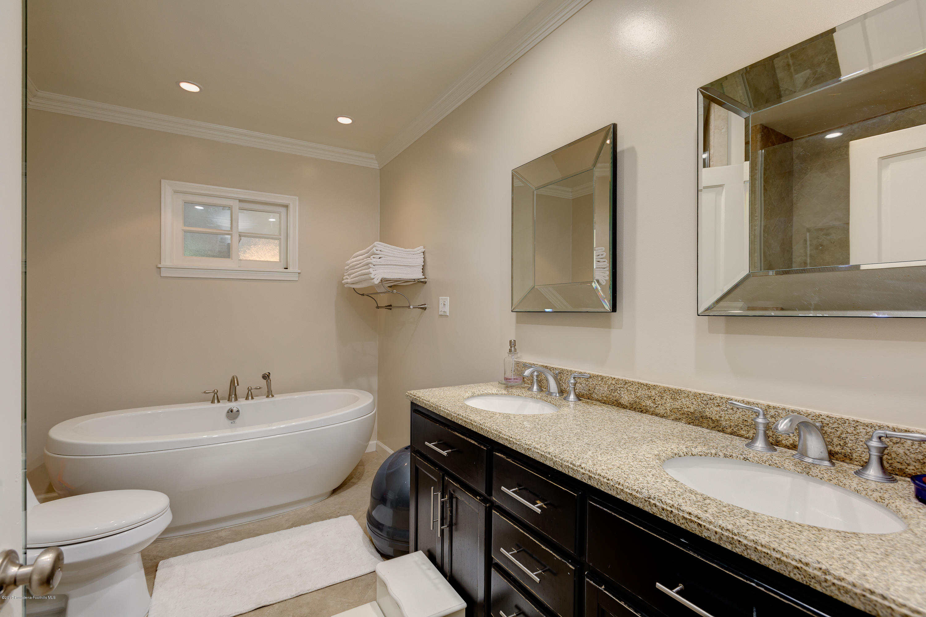 3740 Greenhill Road Pasadena, CA 91107 - Photo 13 of 23 a bathroom with a granite countertop sink and a mirror with toilet