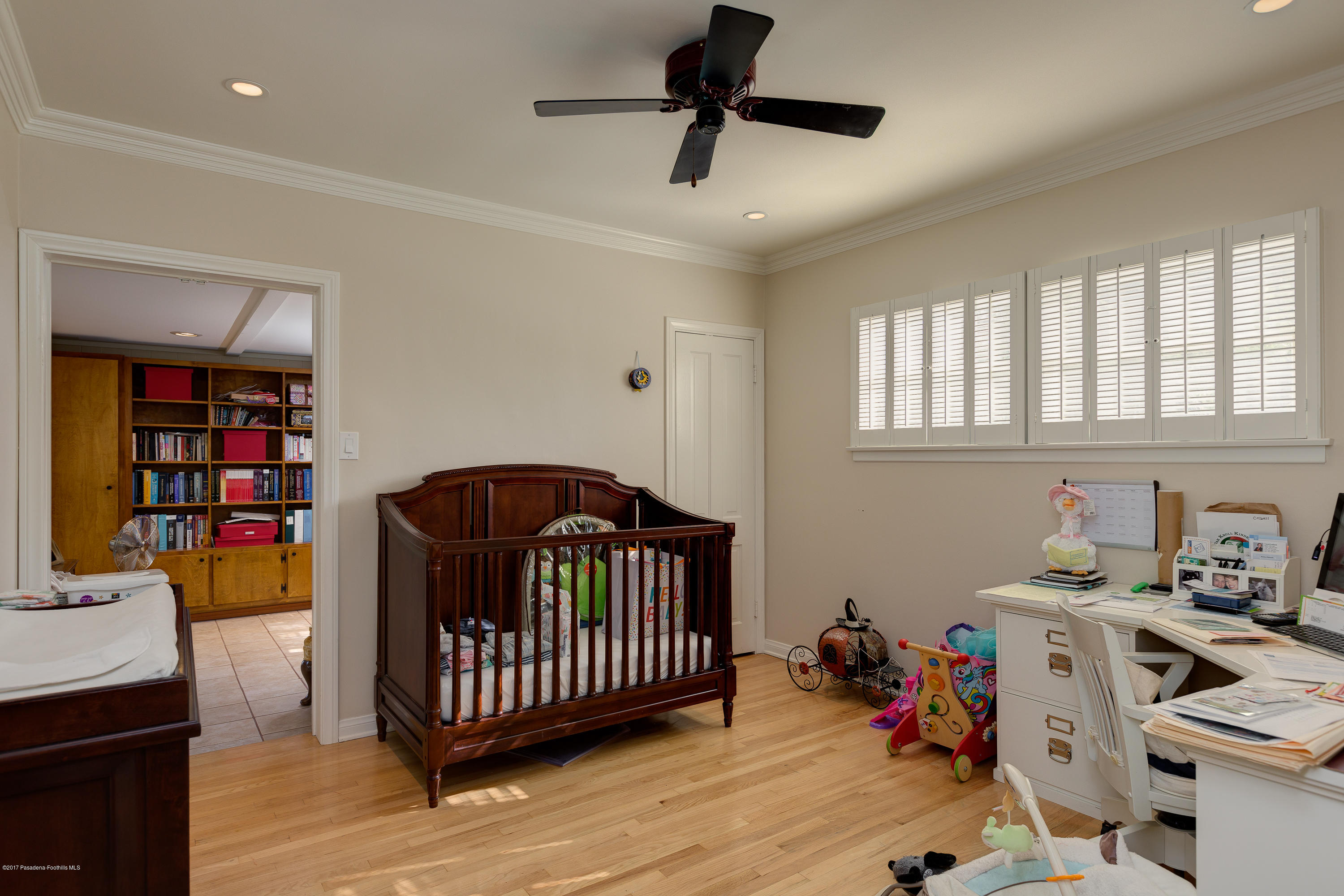 3740 Greenhill Road Pasadena, CA 91107 - Photo 16 of 23 a bedroom with a bed and wooden floor