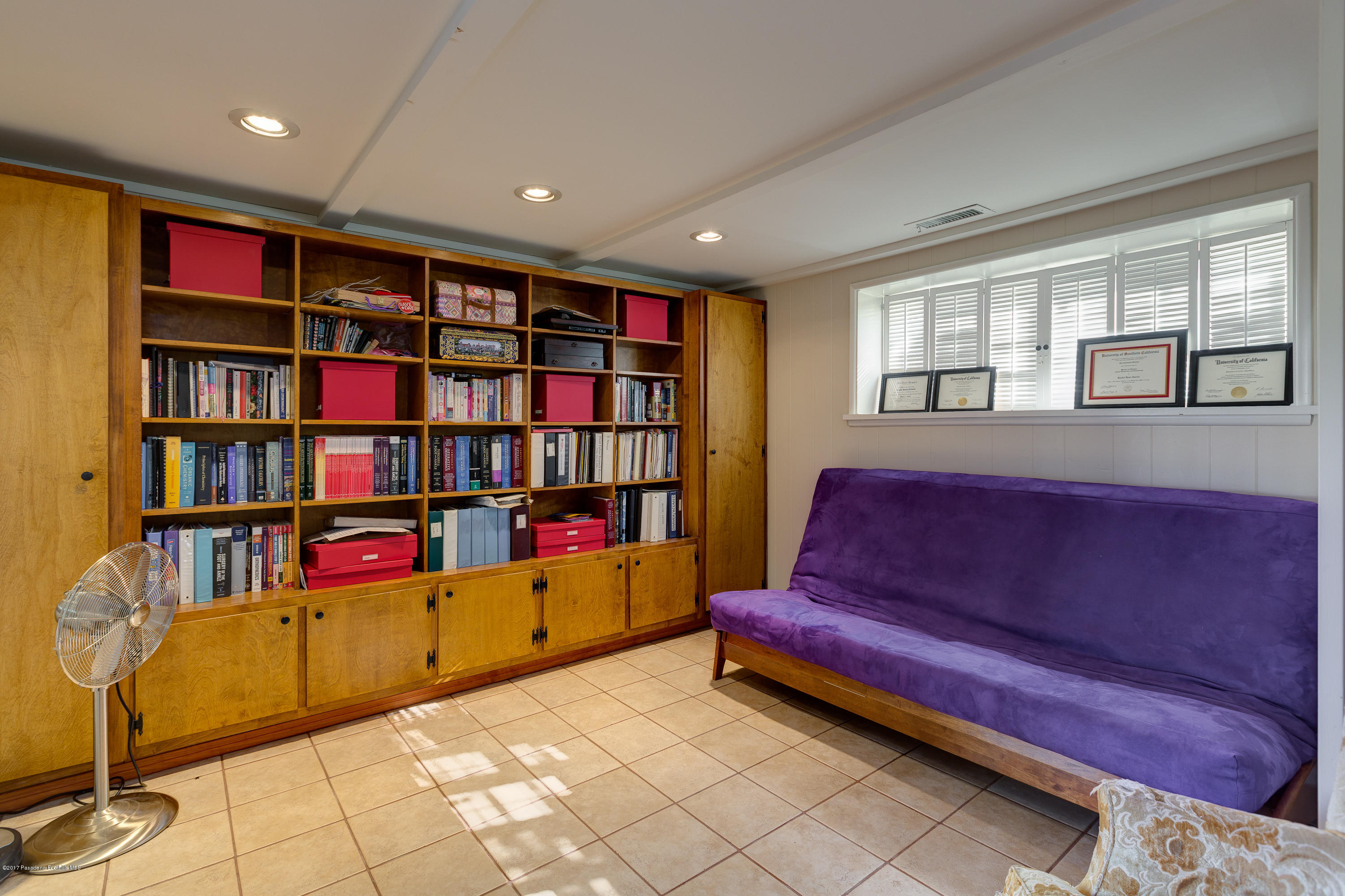 3740 Greenhill Road Pasadena, CA 91107 - Photo 17 of 23 a living room with couch and a book shelf