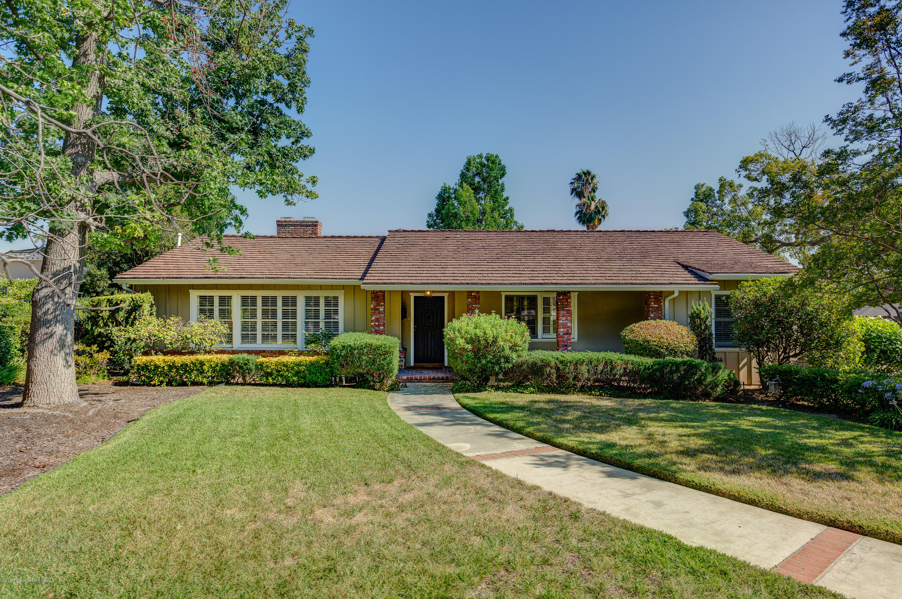 3740 Greenhill Road Pasadena, CA 91107 - Photo 3 of 23 a front view of a house with a yard