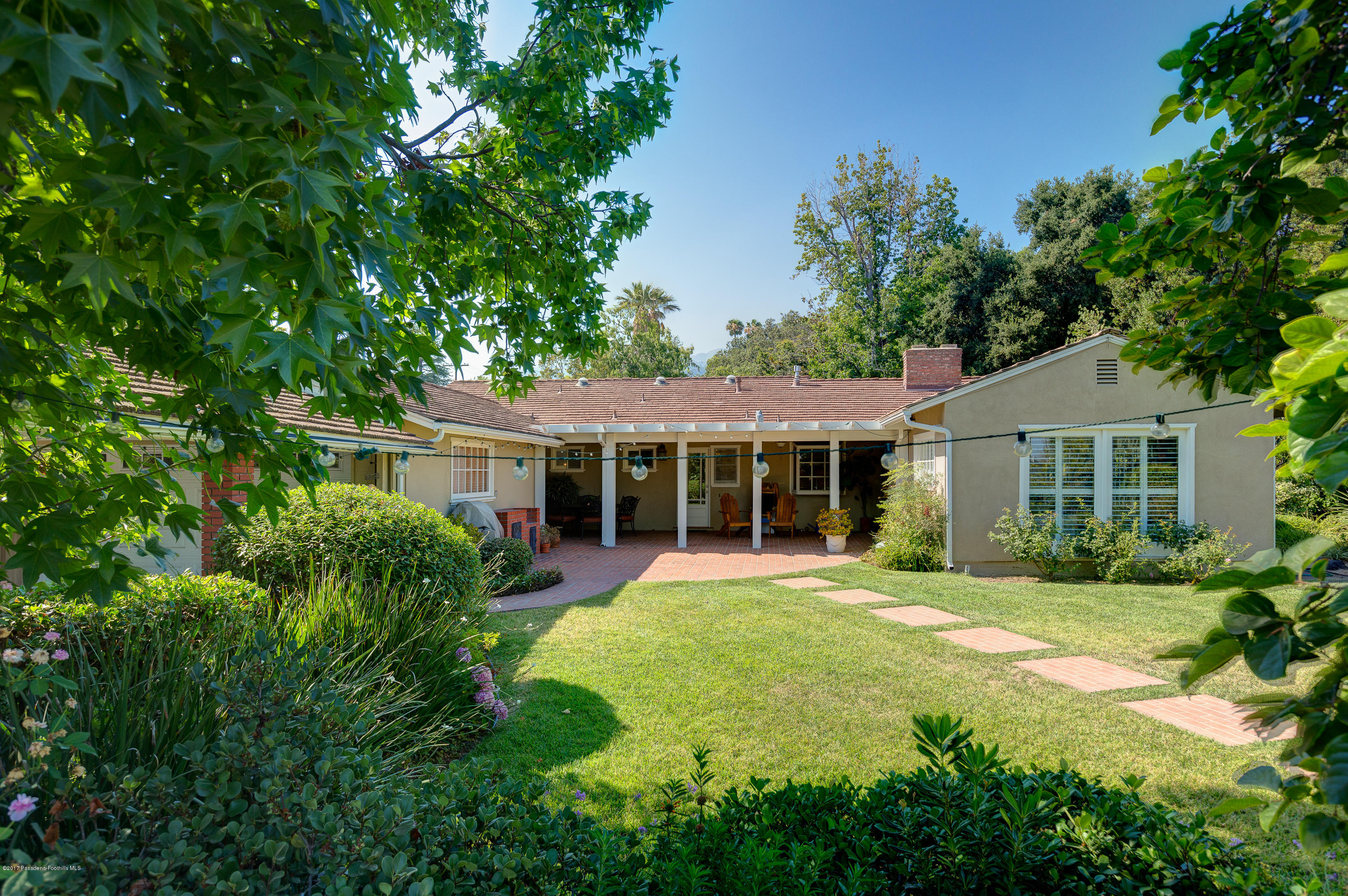 3740 Greenhill Road Pasadena, CA 91107 - Photo 21 of 23 a front view of a house with a garden