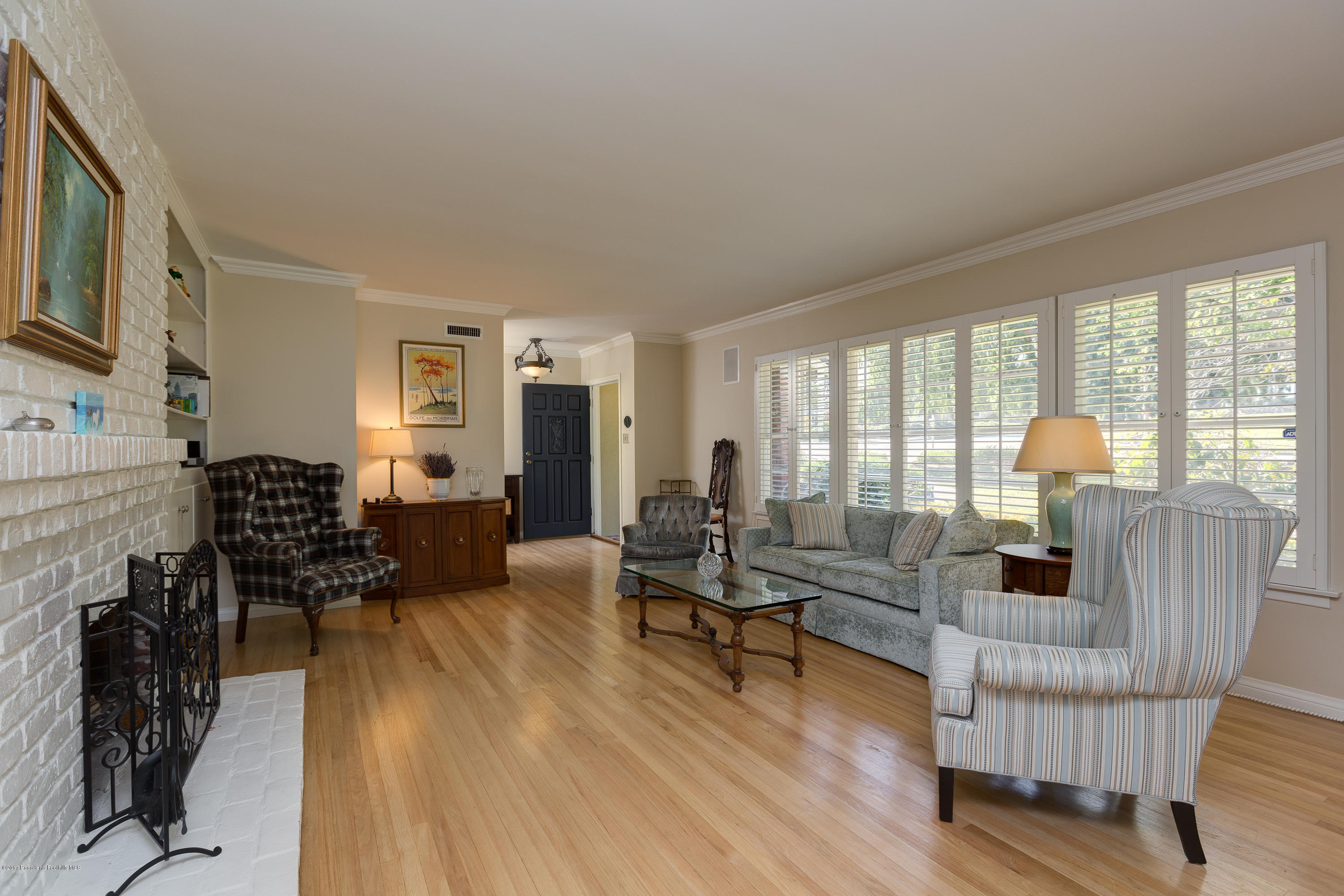 3740 Greenhill Road Pasadena, CA 91107 - Photo 4 of 23 a living room with furniture and a flat screen tv with wooden floor