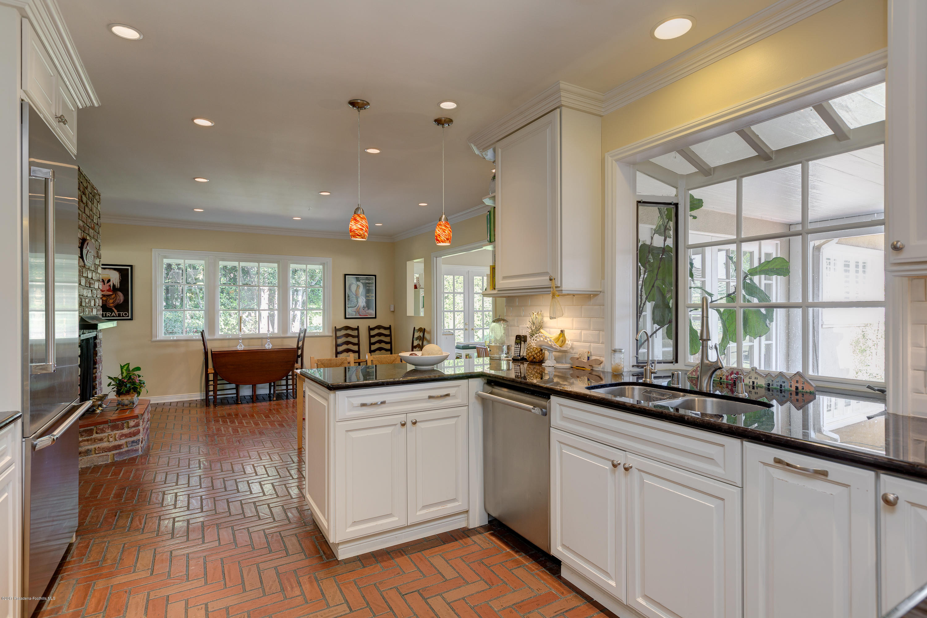 3740 Greenhill Road Pasadena, CA 91107 - Photo 9 of 23 a kitchen with lots of counter space and a sink