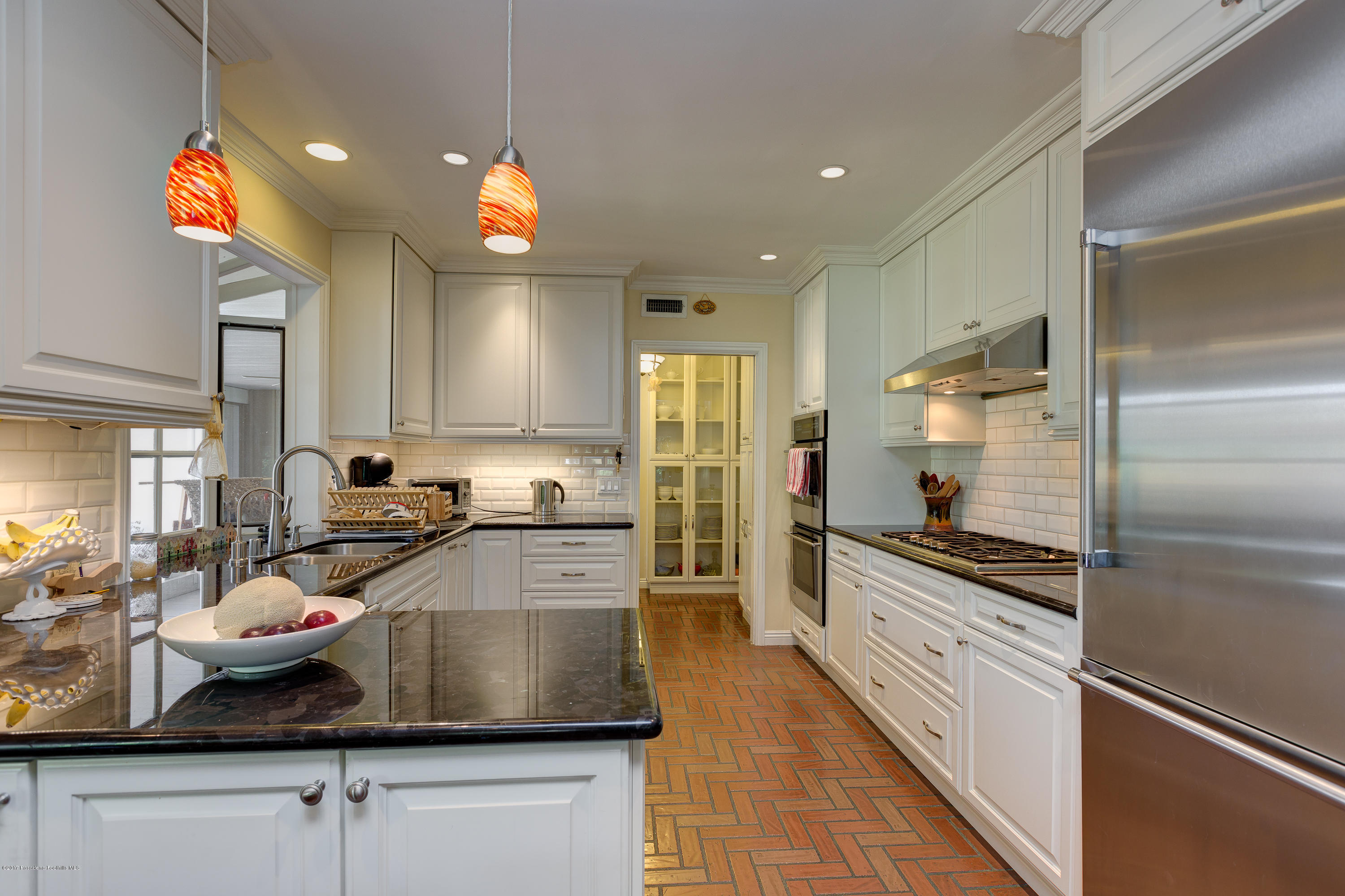 3740 Greenhill Road Pasadena, CA 91107 - Photo 10 of 23 a kitchen with lots of counter space and appliances