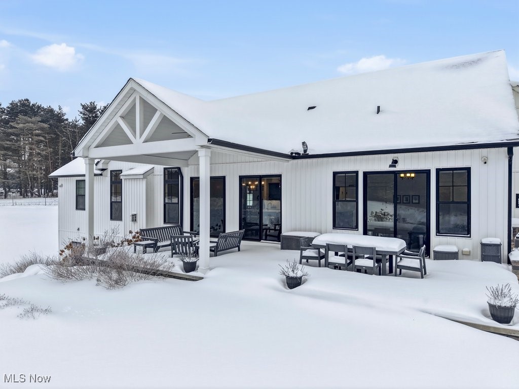 2941 Southern Road Richfield, OH 44286 - Photo 38 of 50 Snow covered property featuring a patio and outdoor dining area