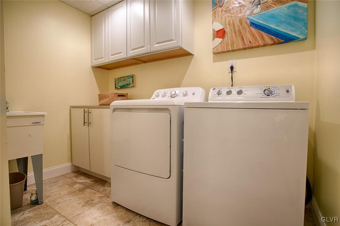 14 Lower Way Road Easton, PA 18045 - Photo 25 of 32 Tiled laundry room with folding table and utility