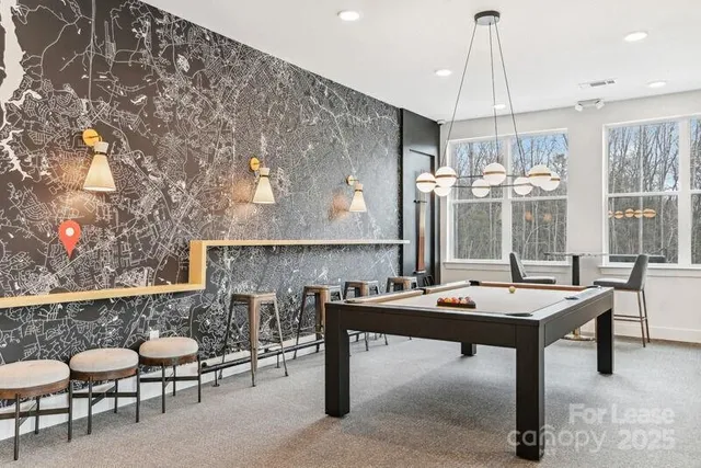 a room with furniture a table and white walls