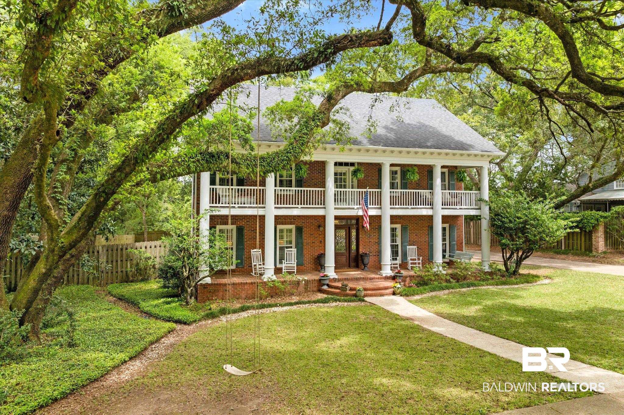 5324 Oak Bend Court Mobile, AL 36609 - Photo 43 of 49 Greek revival inspired property featuring covered porch, brick siding, fence, a front lawn, and a balcony