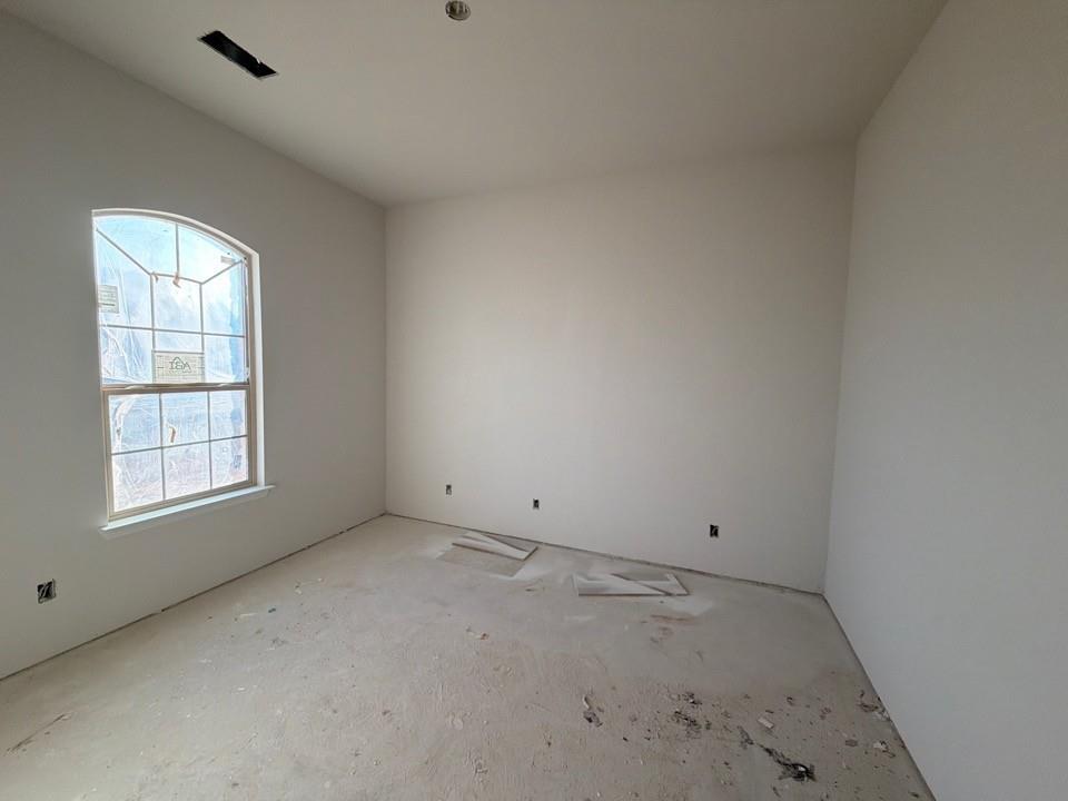1249 Sabine River Lane Springtown, TX 76082 - Photo 3 of 9 an empty room with windows