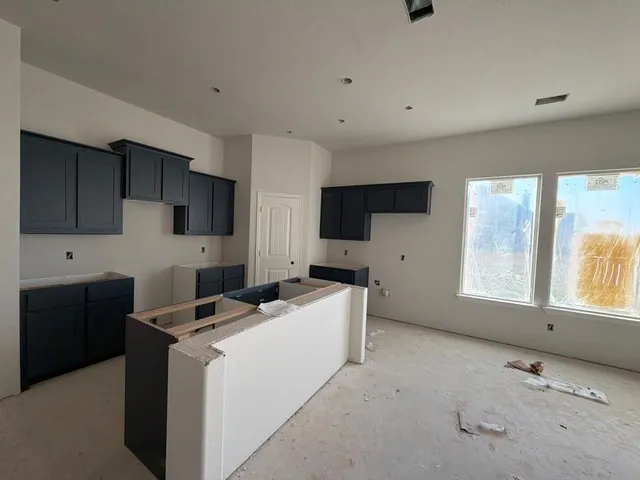 a view of a kitchen with electric appliances