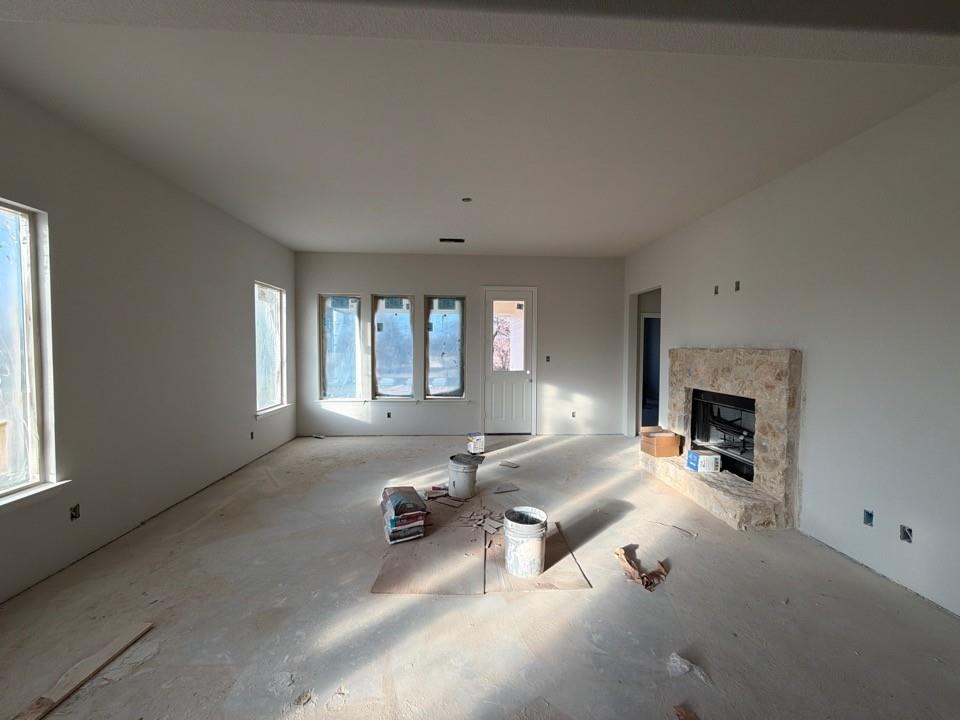 1249 Sabine River Lane Springtown, TX 76082 - Photo 5 of 9 a room with furniture and a fireplace