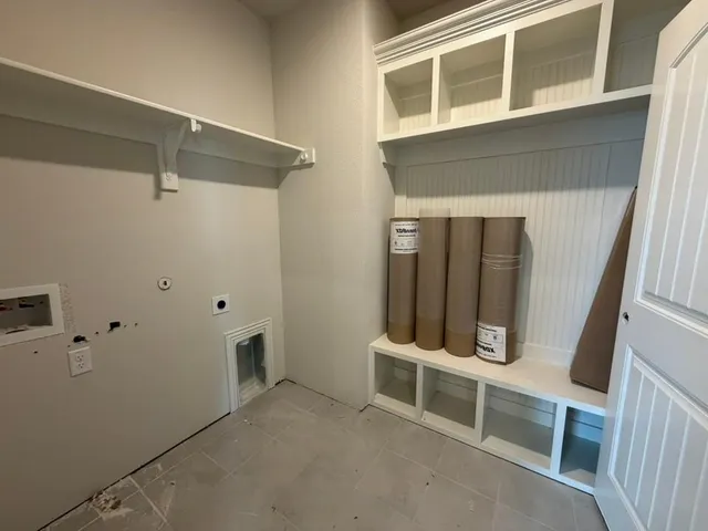 a view of an empty room with stairs