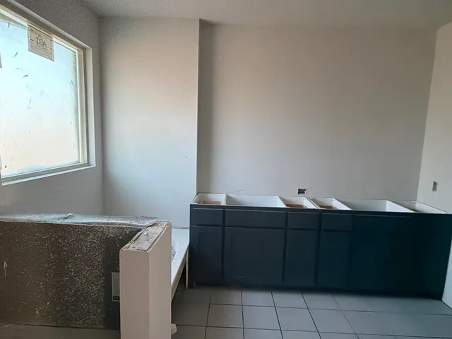 a room with a cabinet and mirror