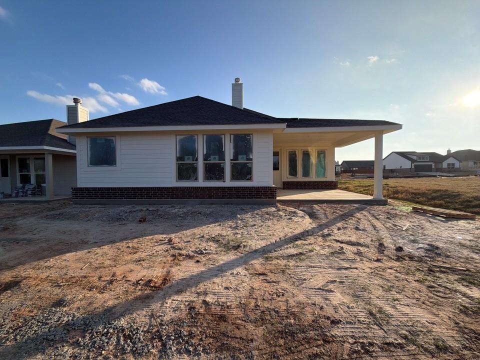 1249 Sabine River Lane Springtown, TX 76082 - Photo 8 of 9 a front view of a house with a yard