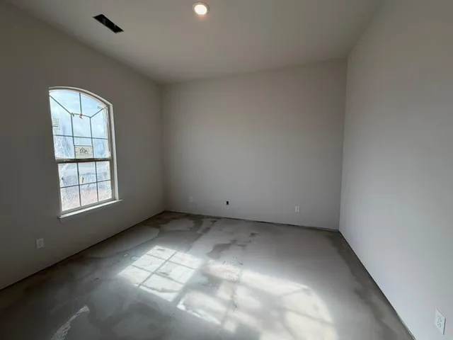 an empty room with windows