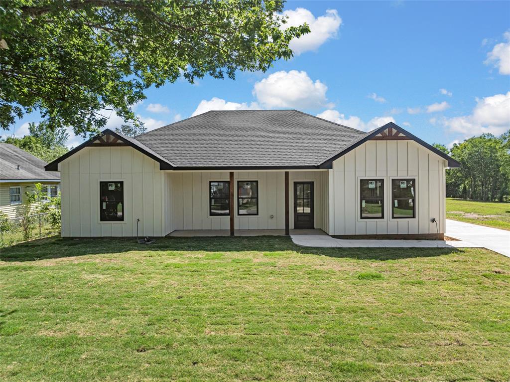 3320 North 27th Street Waco, TX 76708 - Photo 2 of 38 a house that has a big yard with large trees