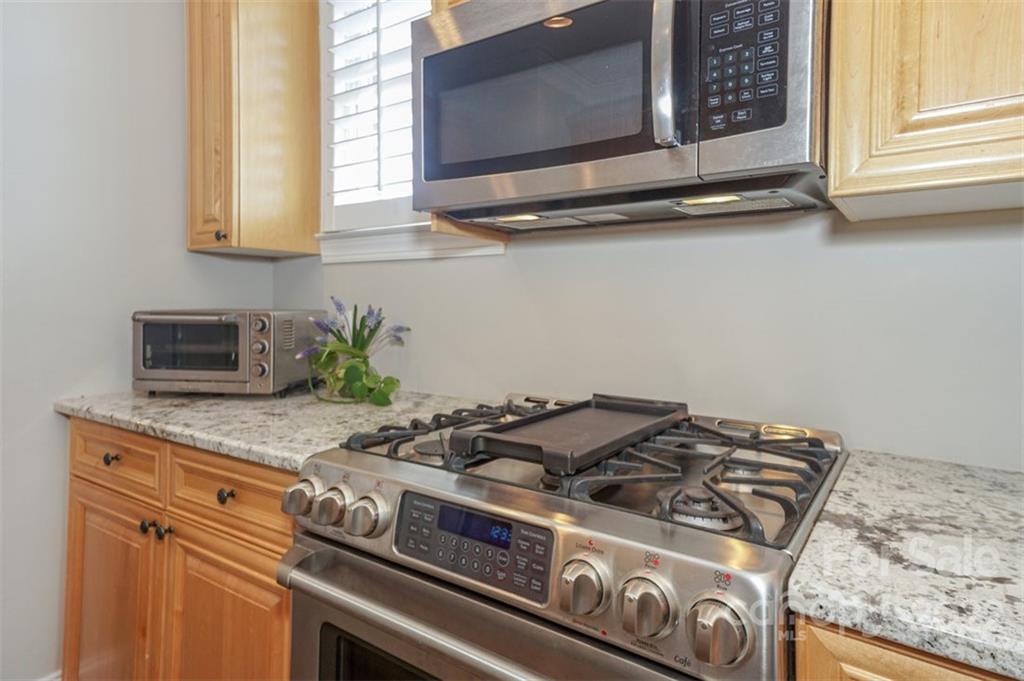 20025 North Cove Road Cornelius, NC 28031 - Photo 22 of 45 a stove top oven sitting inside of a kitchen