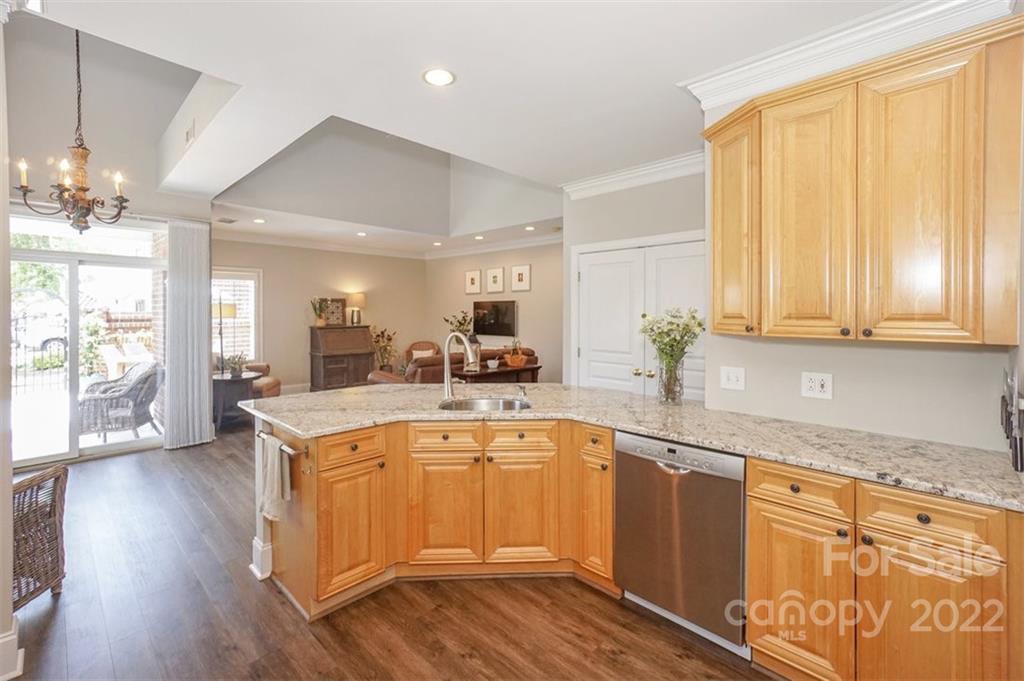 20025 North Cove Road Cornelius, NC 28031 - Photo 23 of 45 a large kitchen with cabinets wooden floor and stainless steel appliances