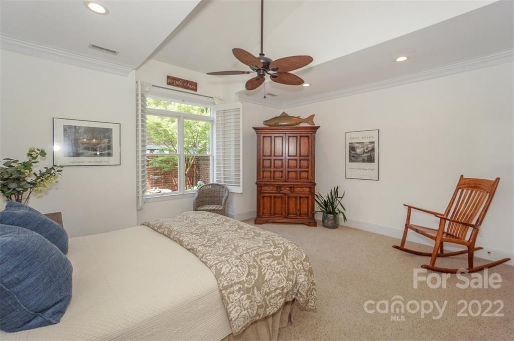 20025 North Cove Road Cornelius, NC 28031 - Photo 24 of 45 a bedroom with a bed a chair and potted plant