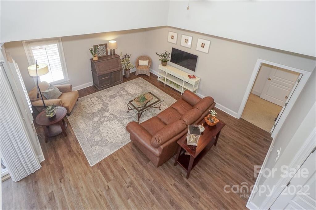20025 North Cove Road Cornelius, NC 28031 - Photo 33 of 45 a living room with furniture and a wooden floor