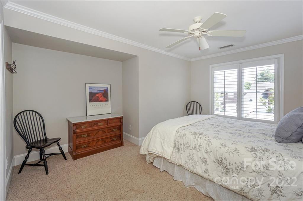 20025 North Cove Road Cornelius, NC 28031 - Photo 35 of 45 a bedroom with a bed dresser and a window