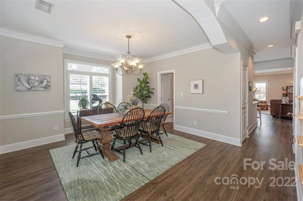 20025 North Cove Road Cornelius, NC 28031 - Photo 6 of 45 a view of a dining room with furniture and wooden floor