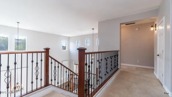 a view of staircase with rug floor