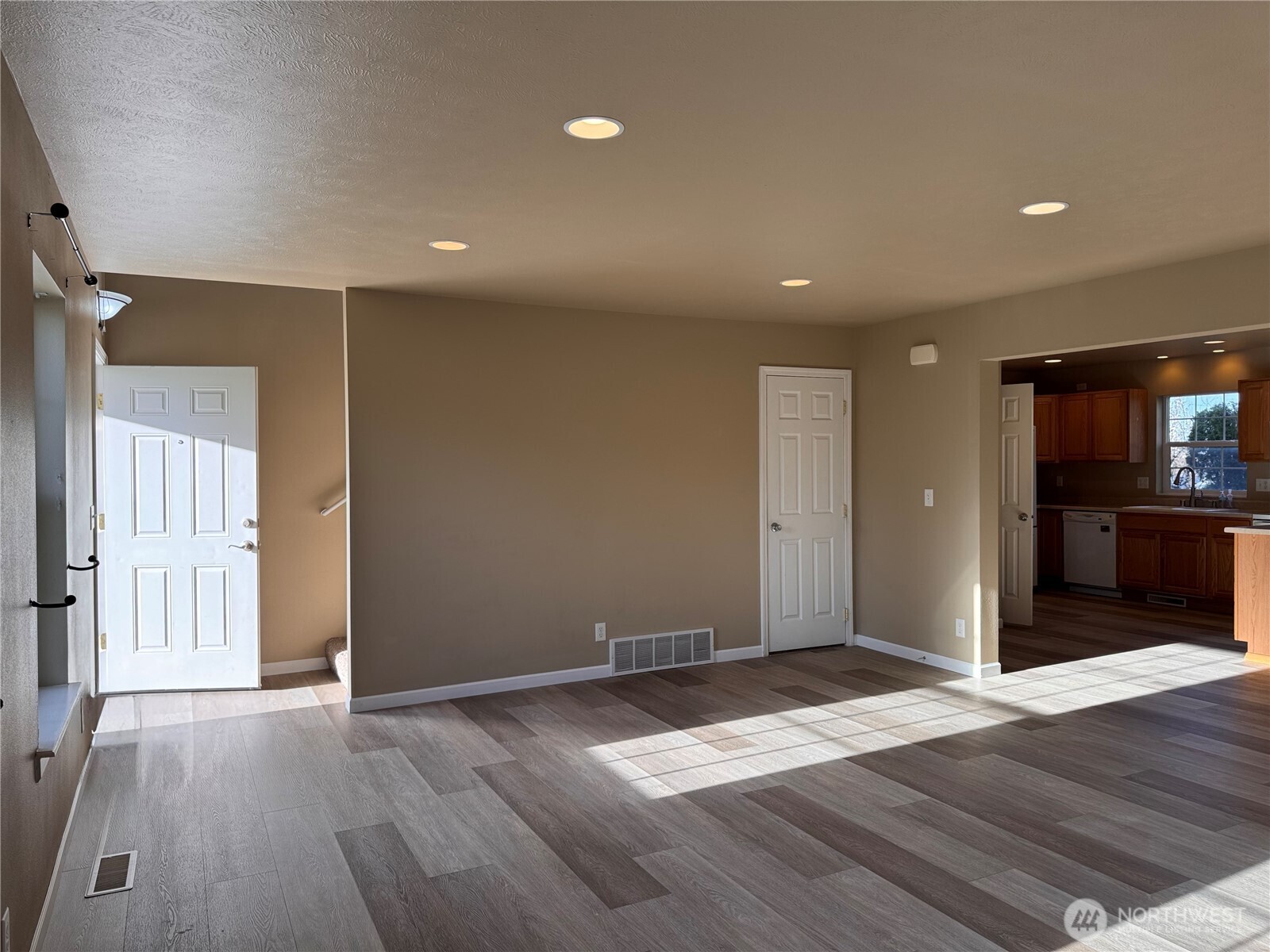 315 North Spangle Avenue Spangle, WA 99031 - Photo 6 of 38 an empty room with wooden floor and windows