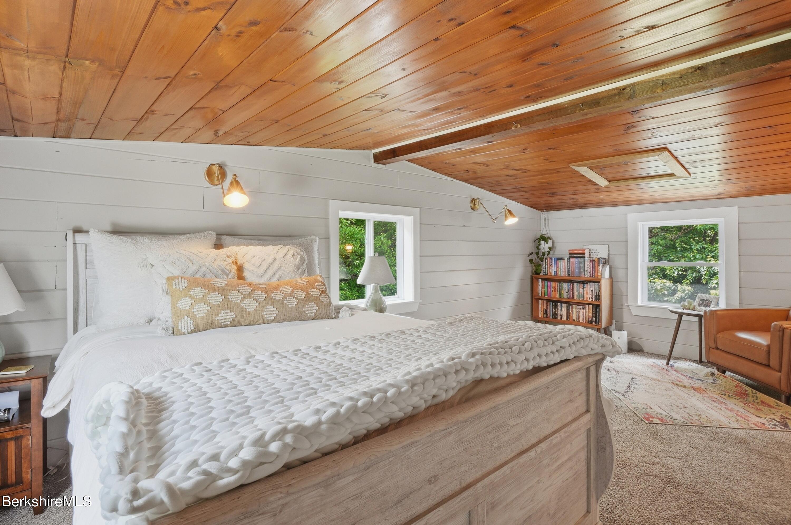 4 David Drive Peru, MA 01235 - Photo 27 of 44 a bedroom with a large bed couch and a window