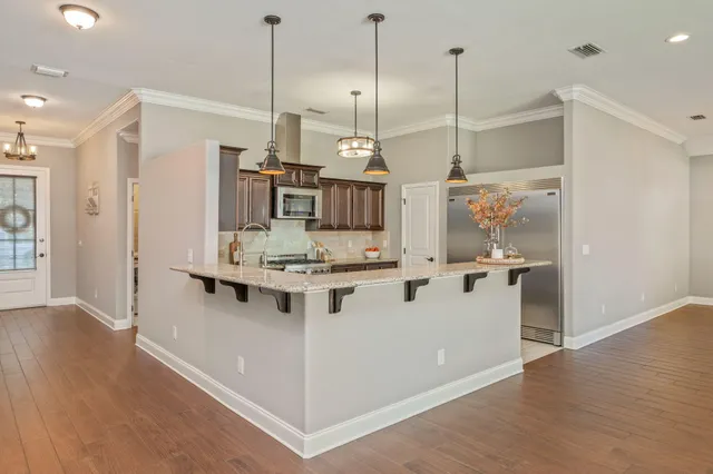 a view of kitchen island with wooden floor