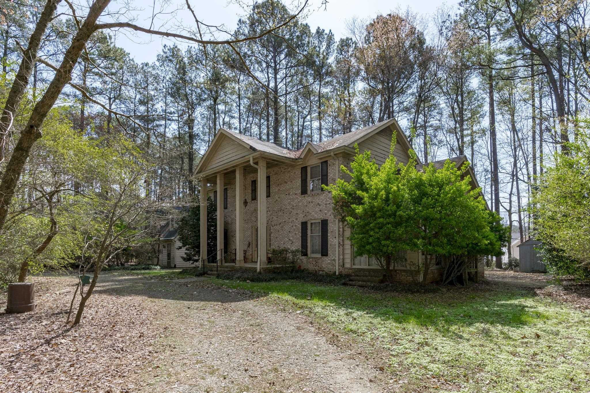 12801 Strickland Road Raleigh, NC 27613 - Photo 13 of 27 a front view of a house with garden
